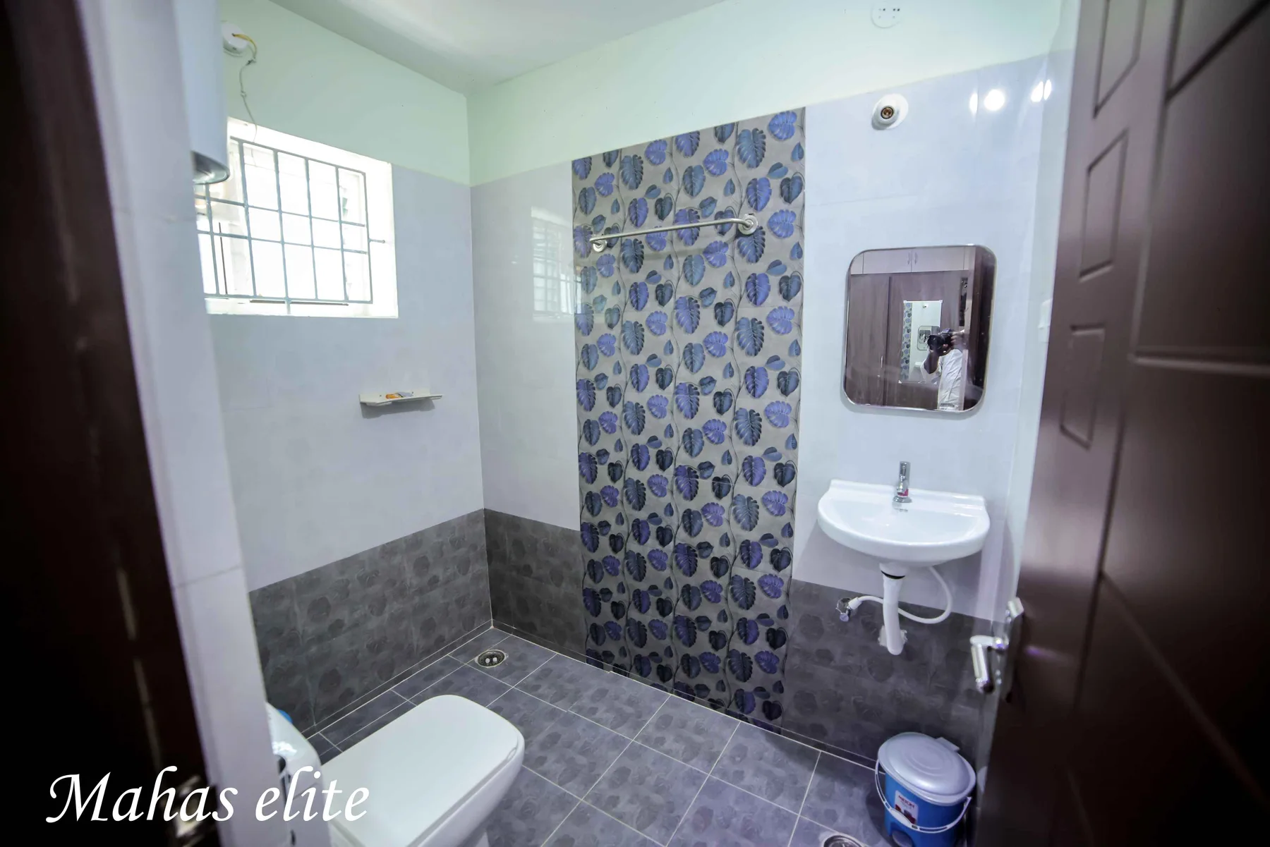 Clean attached bathroom at Mahas Elite