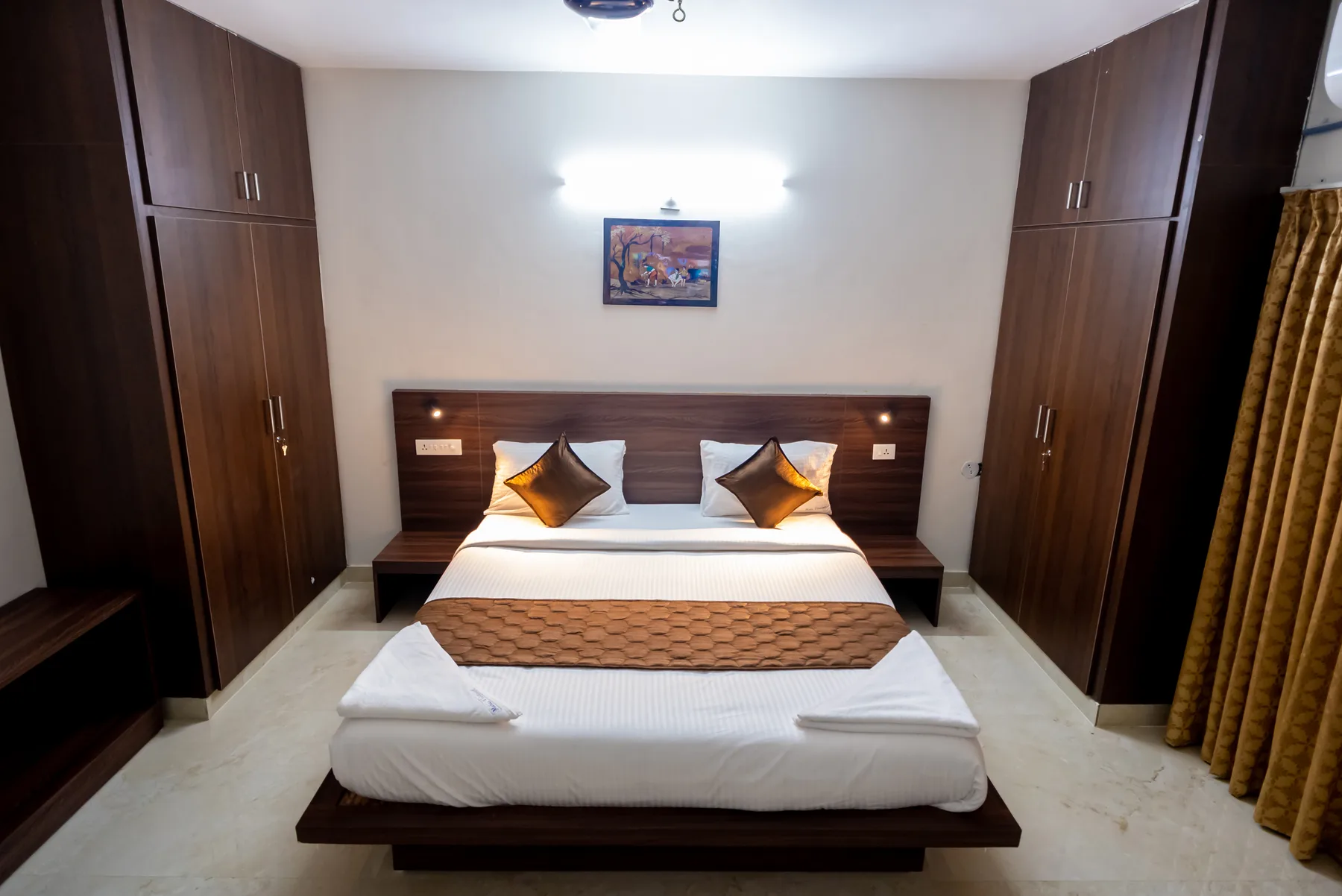 Spacious bedroom with wardrobes at Mahas Vrindavan
