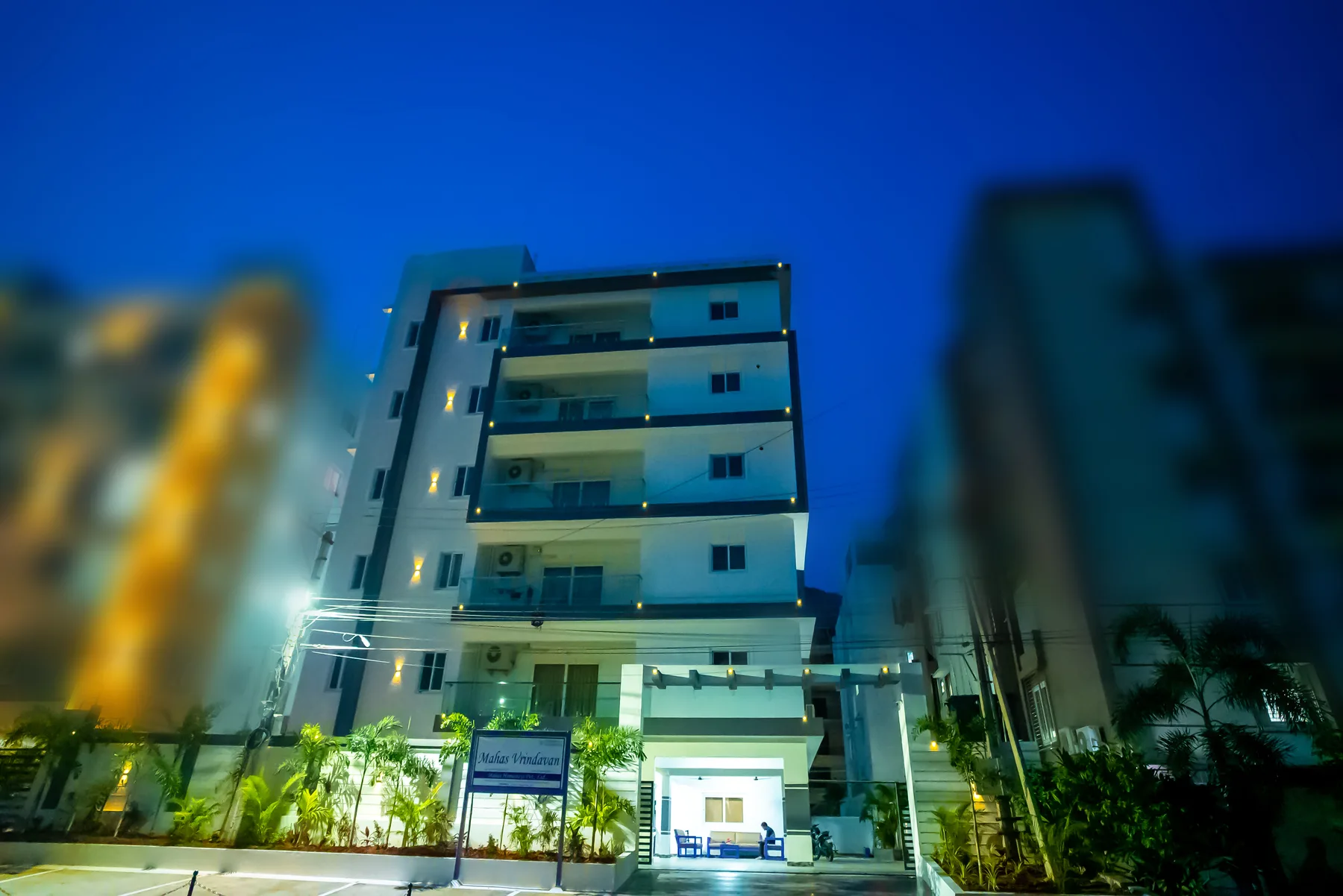Mahas Vrindavan apartment building illuminated in the evening